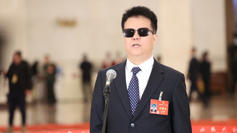 Wang Yongcheng, a deputy to China's 14th National People's Congress, speaks at Deputies' Corridor in the Great Hall of the People in Beijing, China, March 8, 2024. /CFP