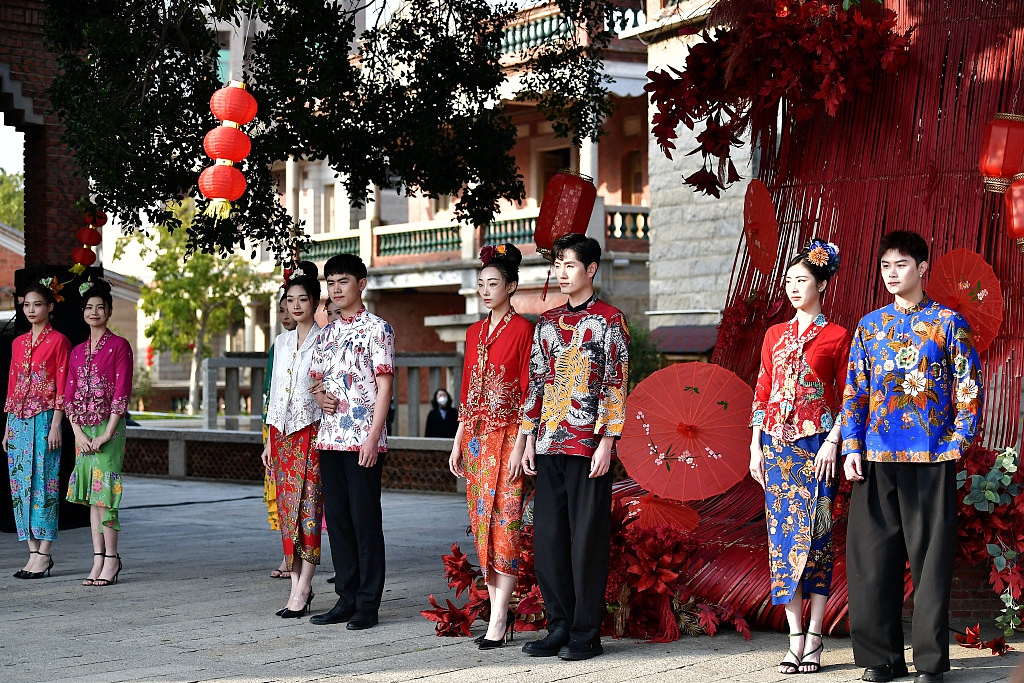 A group of models participate in a fashion show in Wulin Traditional Village in Jinjiang, Fujian Province on March 8, 2024, showcasing the Singaporean peranakan clothing style. /CFP