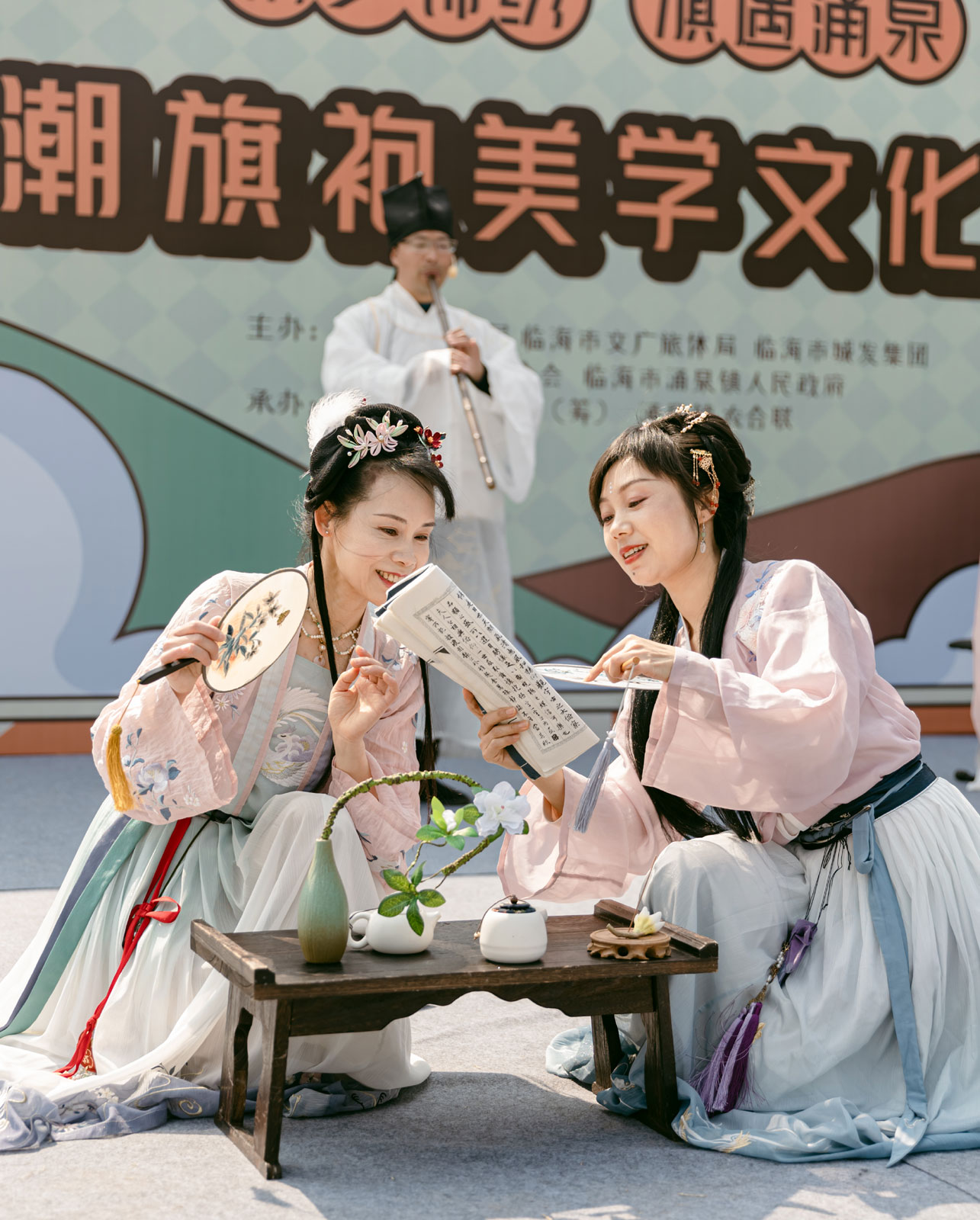 Performers dressed in traditional Chinese costumes are seen at a cultural fair at Yongquan Town in Linhai City, Zhejiang Province on March 7, 2024. /Photo provided to CGTN by the Government of Yongquan Town