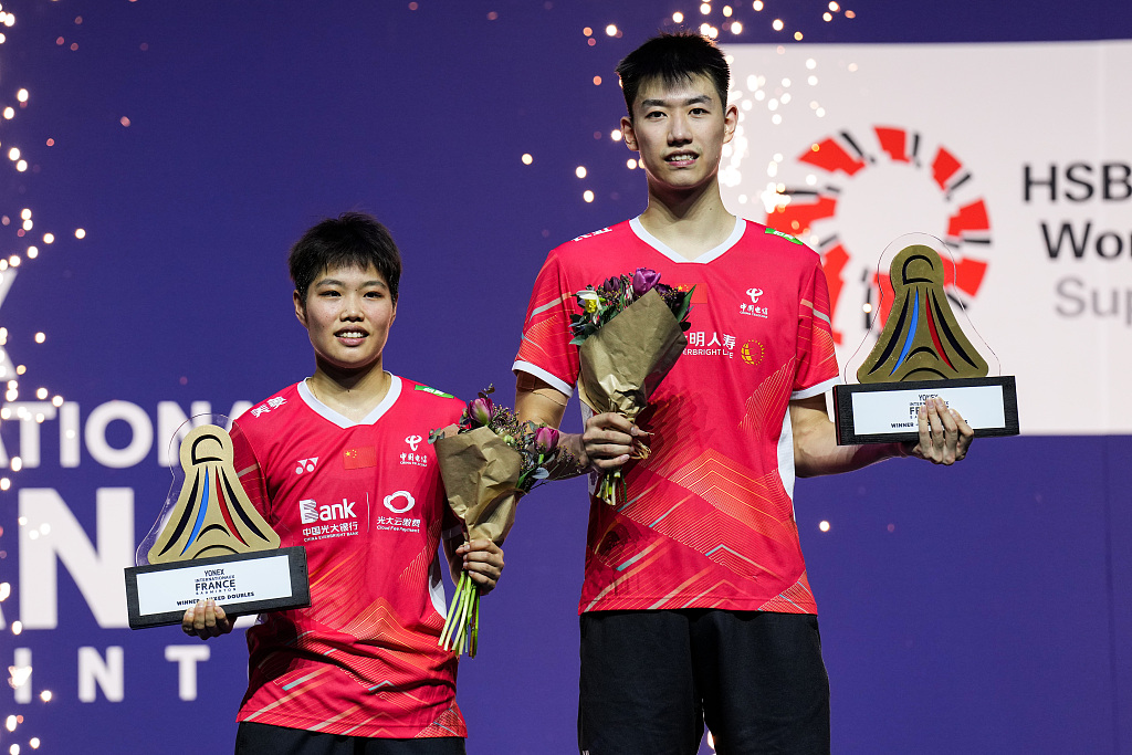 Feng Yanzhe (R) and Huang Dongpiong of China after winning the mixed doubles final of the French Open at Adidas Arena in Paris, France, March 10, 2024. /CFP