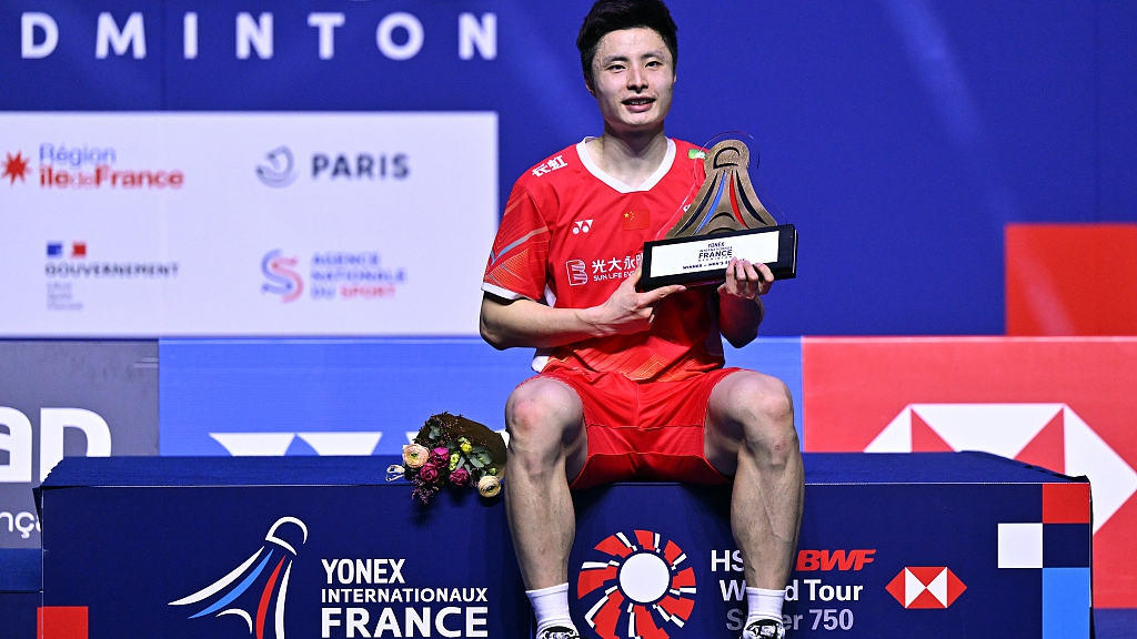 China's Shi Yuqi poses with the trophy on the podium after winning the men's single final of the French Open at Adidas Arena in Paris, France, March 10, 2024. /CFP