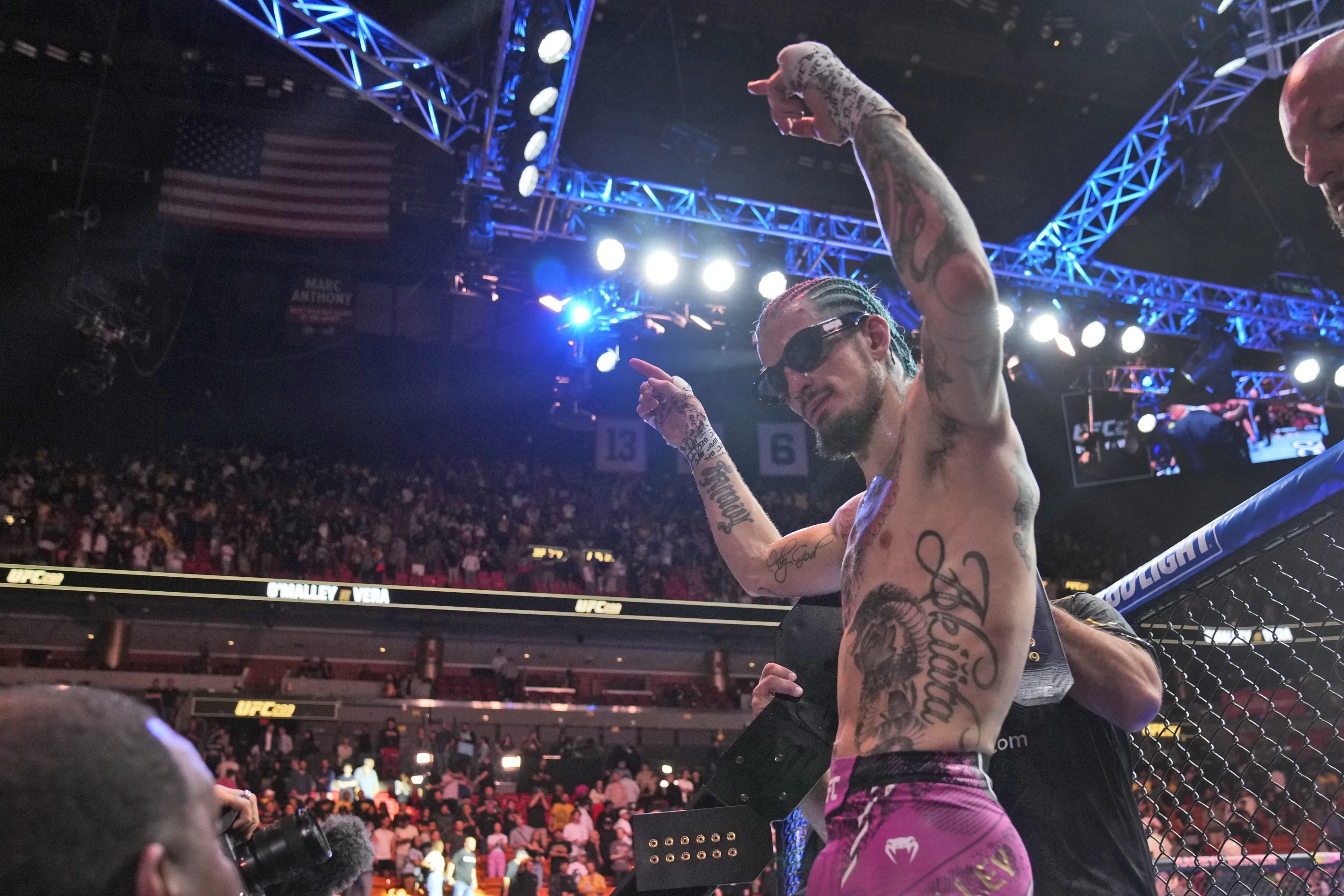 Sean O'Malley of the U.S. celebrates after beating Marlon Vera of Ecuador by unanimous decision (50-45, 50-45, 50-44) in the main event of UFC 299 at the Kaseya Center in Miami, Florida, March 9, 2024. /AP