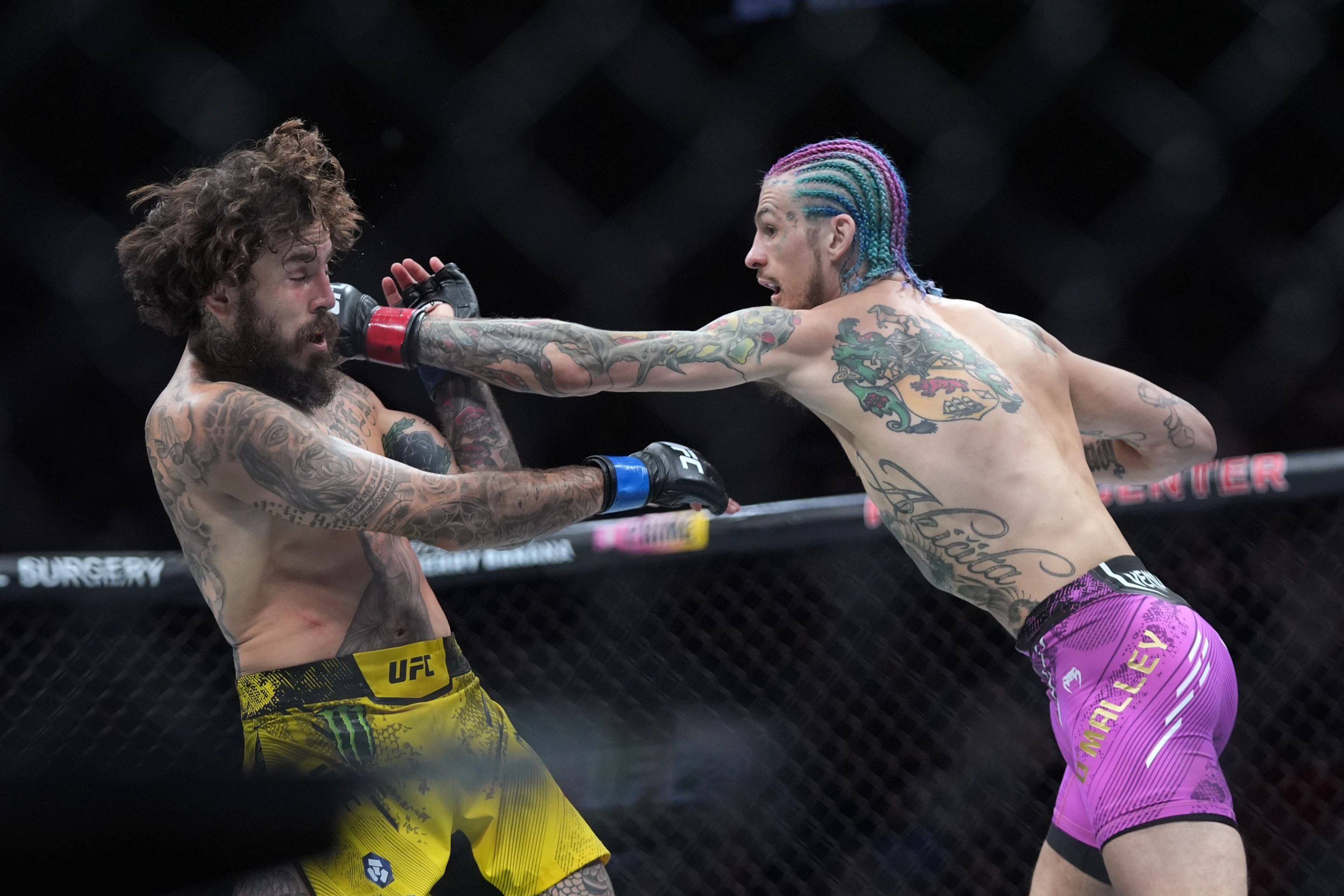 Sean O'Malley (R) of the U.S. punches Marlon Vera of Ecuador in the main event of UFC 299 at the Kaseya Center in Miami, Florida, March 9, 2024. /AP