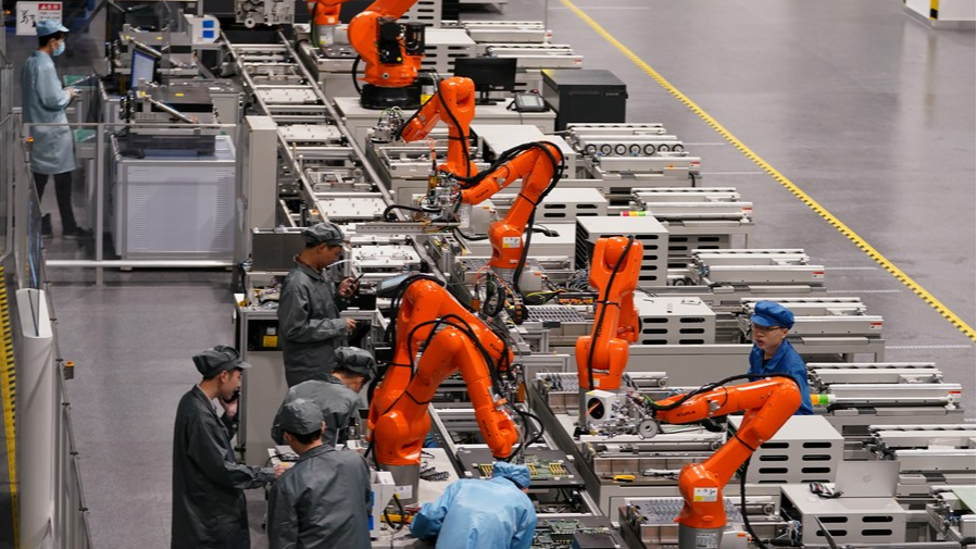 Technical workers work on a production line at a future factory of Unisplendour Corporation Limited (UNIS) in Xiaoshan District of Hangzhou, east China's Zhejiang Province, April 27, 2023. /Xinhua