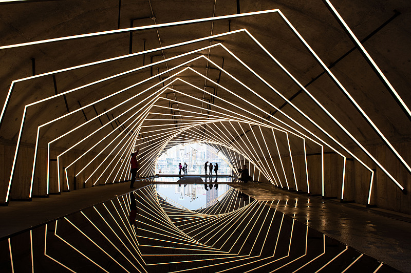 A revamped tunnel featuring a contemporary geometric lighting design has become a popular tourist spot in Chongqing, March 11, 2024. /CFP