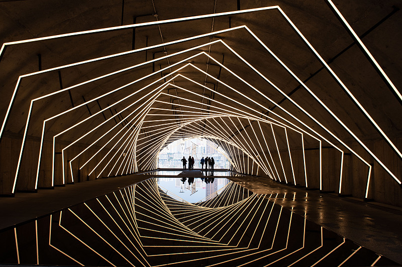 A revamped tunnel featuring a contemporary geometric lighting design has become a popular tourist spot in Chongqing, March 11, 2024. /CFP