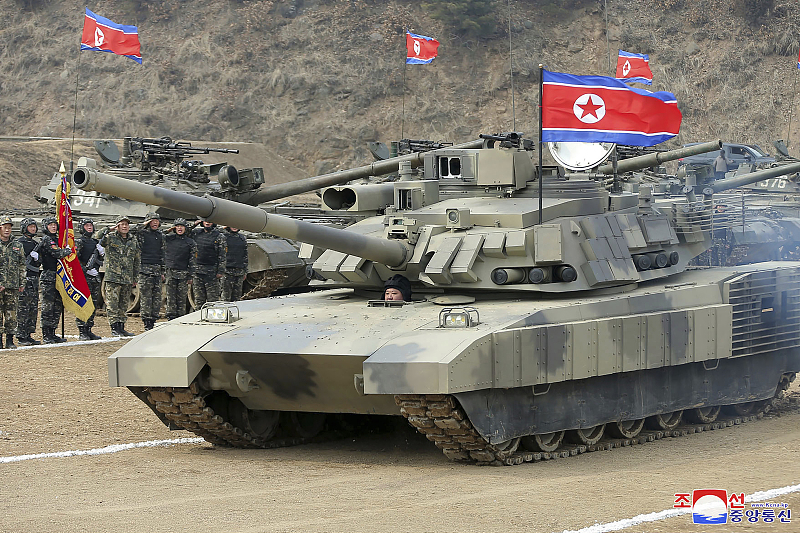 Kim Jong Un, top leader of the DPRK, drives a new-type tank, March 13, 2024. /CFP