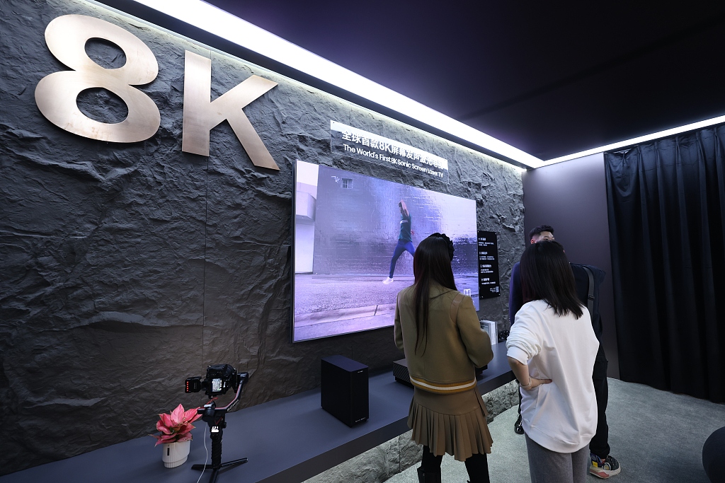 Visitors check out an 8K ultra-high-definition TV at AWE2024, Shanghai Municipality, east China, March 14, 2024. /CFP