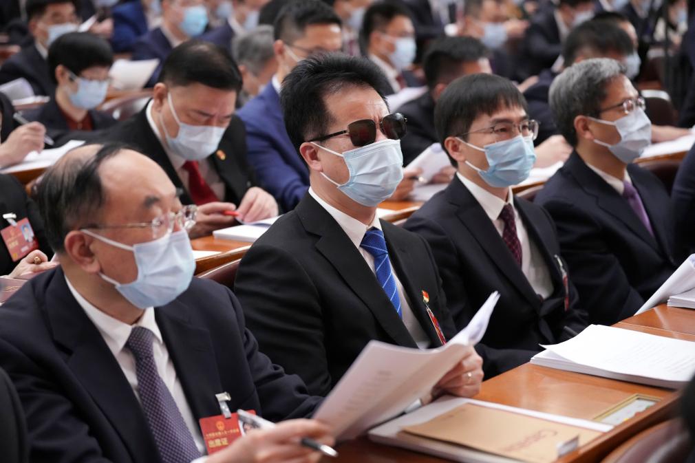 Wang Yongcheng (L2) at the opening of the first session of the 14th National People's Congress on March 5, 2023. /Xinhua