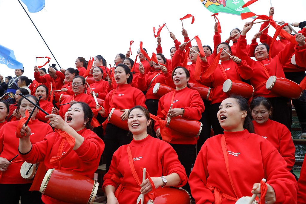 A group of female football fans cheer for the teams during the Village Super League in Rongjiang, China, January 13, 2024. /CFP