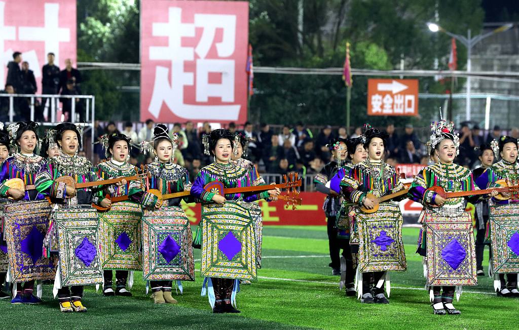 Performers from the China's Dong ethnic group perform prior to a Village Super League match in Rongjiang, China, January 18, 2024. /CFP