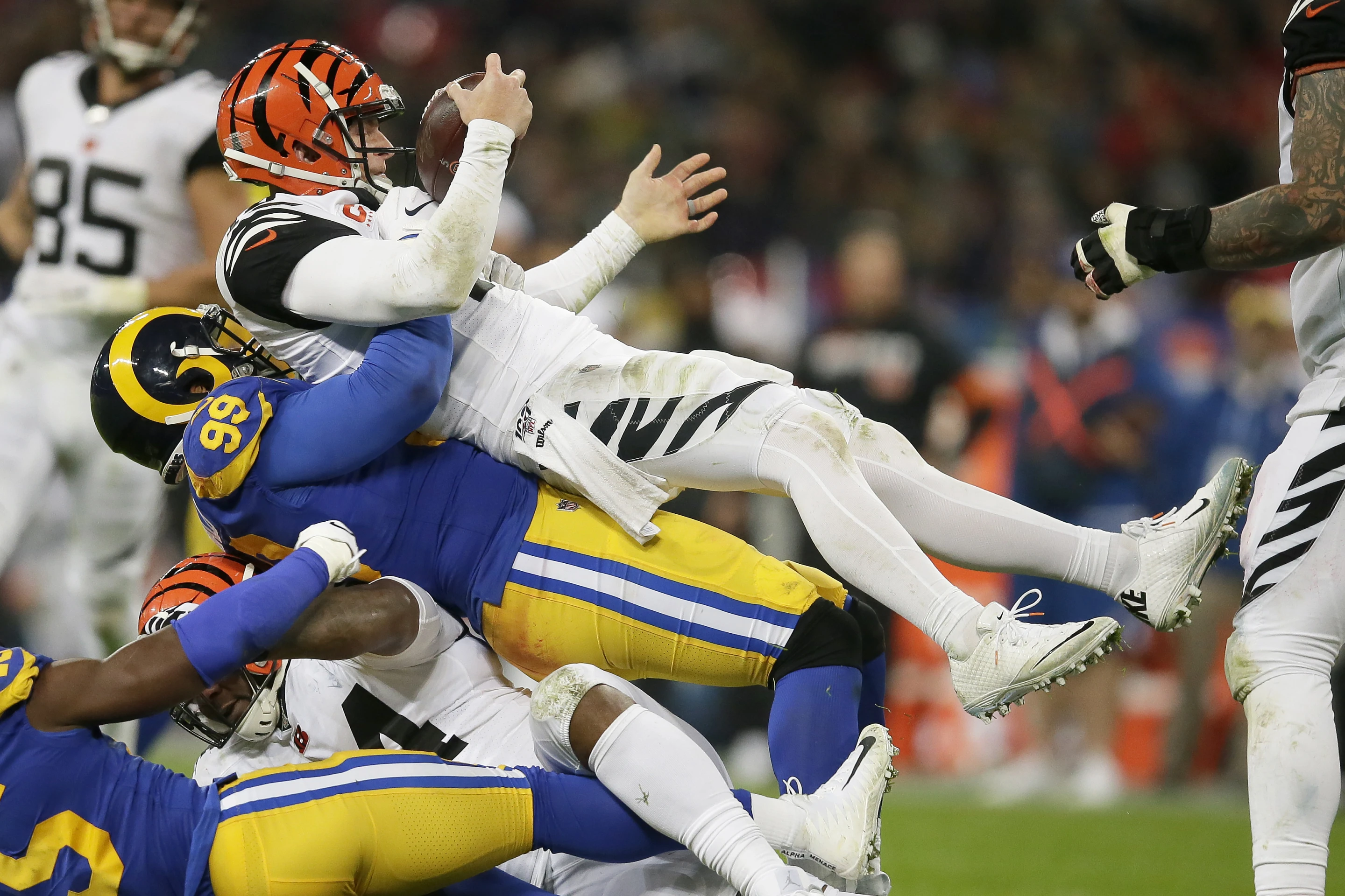 Defensive tackle Aaron Donald (#99) of the Los Angeles Rams sacks quarterback Joe Burrow of the Cincinnati Bengals in Super Bowl LVI at SoFi Stadium in Inglewood, California, U.S., February 13, 2022. /AP