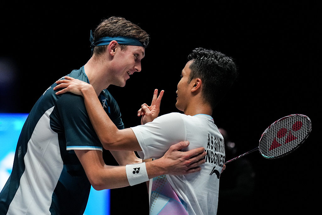 Anthony Sinisuka Ginting (R) of Indonesia greets Viktor Axelsen of Denmark after their men's singles quarter-final during the All England Open Badminton Championships at Utilita Arena in Birmingham, England, March 15, 2024. /CFP