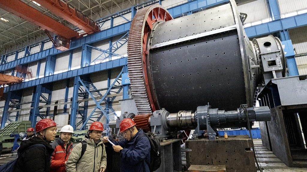 Engineers examine equipments to be put in use in a copper mine project in Angola, in China's northeast Liaoning Province, March 12, 2024. /CFP