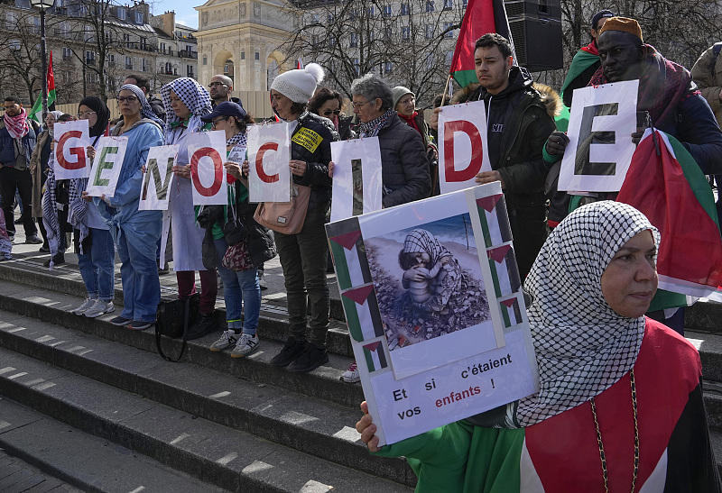 Pro-Palestinians supporters stage a protest with placards in support of Palestinian people in Gaza, in Paris, March 16, 2024. /CFP