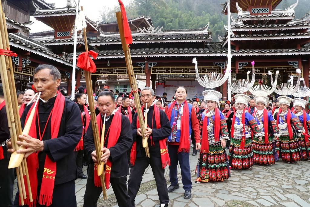 Residents play lusheng, a reed-pipe wind instrument, and dance during the Zhaolong Festival in Xiaodanjiang Miao Ethnic Village in Rongjiang County, southwest China's Guizhou Province on March 17, 2024. /CFP