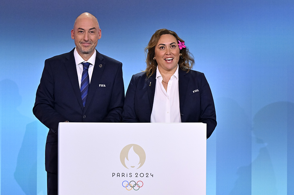 Jaime Yarza, FIFA's director of tournaments and Sarai Bareman, FIFA chief women's football officer onstage during the Olympic football tournament final draw in Paris, France, March 20, 2024. /CFP