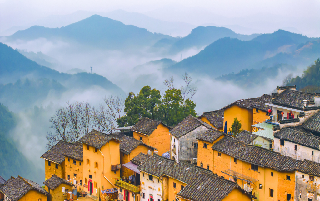 The mist-enveloped Yangchan Tulou scenic area in Yangchan Village of Huangshan City, east China's Anhui Province is seen in this photo taken on March 17, 2024. /CFP