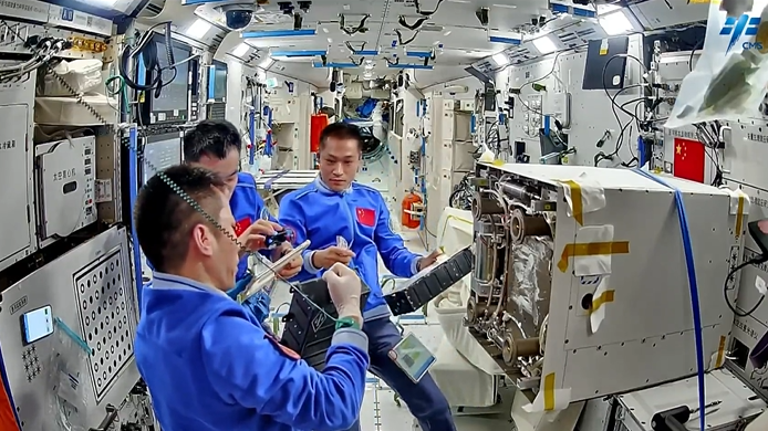 China's Shenzhou-17 crew work in China's space station. /CMS