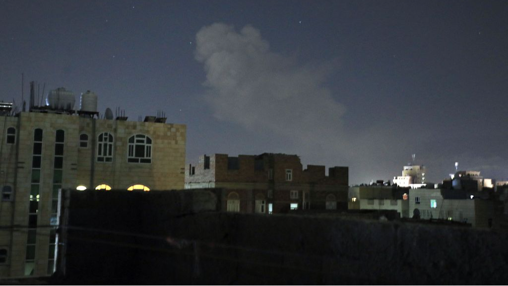 A plume of smoke rising after an airstrike in the Yemeni capital, Sanaa, March 22, 2024.