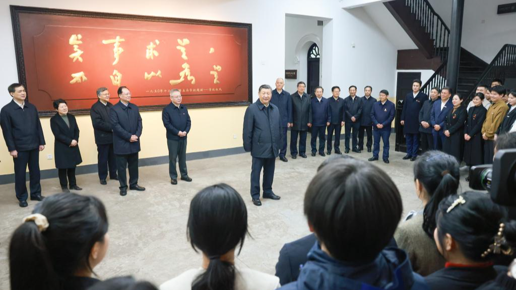 Chinese President Xi Jinping, also general secretary of the Communist Party of China Central Committee and chairman of the Central Military Commission, talks with teachers and students while visiting a campus of Hunan First Normal University in Changsha, central China's Hunan Province, March 18, 2024. /Xinhua
