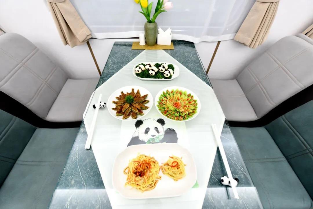 Passengers can enjoy exquisite panda-themed food on the Shifang tourist train, which made its debut in Chengdu, Sichuan Province, on March 22, 2024. /CMG