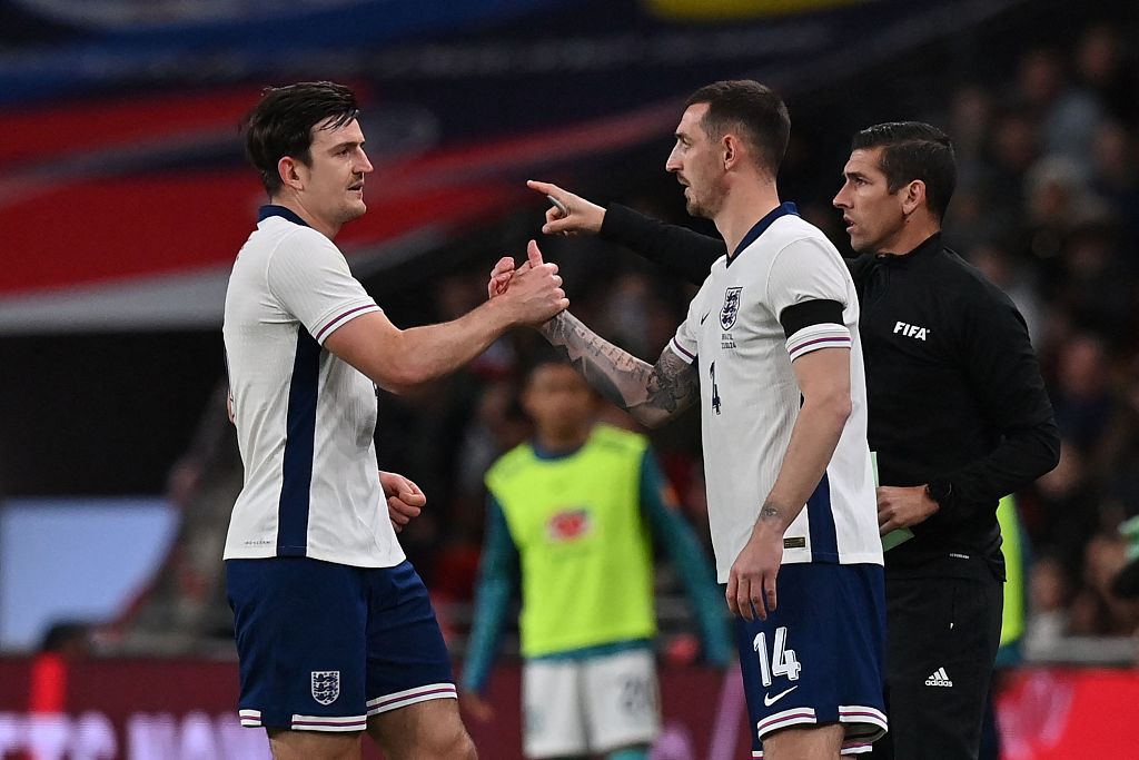 Harry Maguire (L) of England substitutes with Lewis Dunk during the friendly against Brazil at Wembley Stadium in London, England, March 23, 2024./CFP