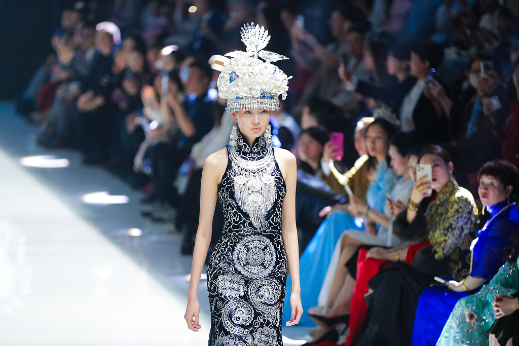 A photo taken on March 23, 2024 shows a model wearing clothes designed with Chinese elements at the opening ceremony of the AW24 China Fashion Week in Beijing, China. /CFP