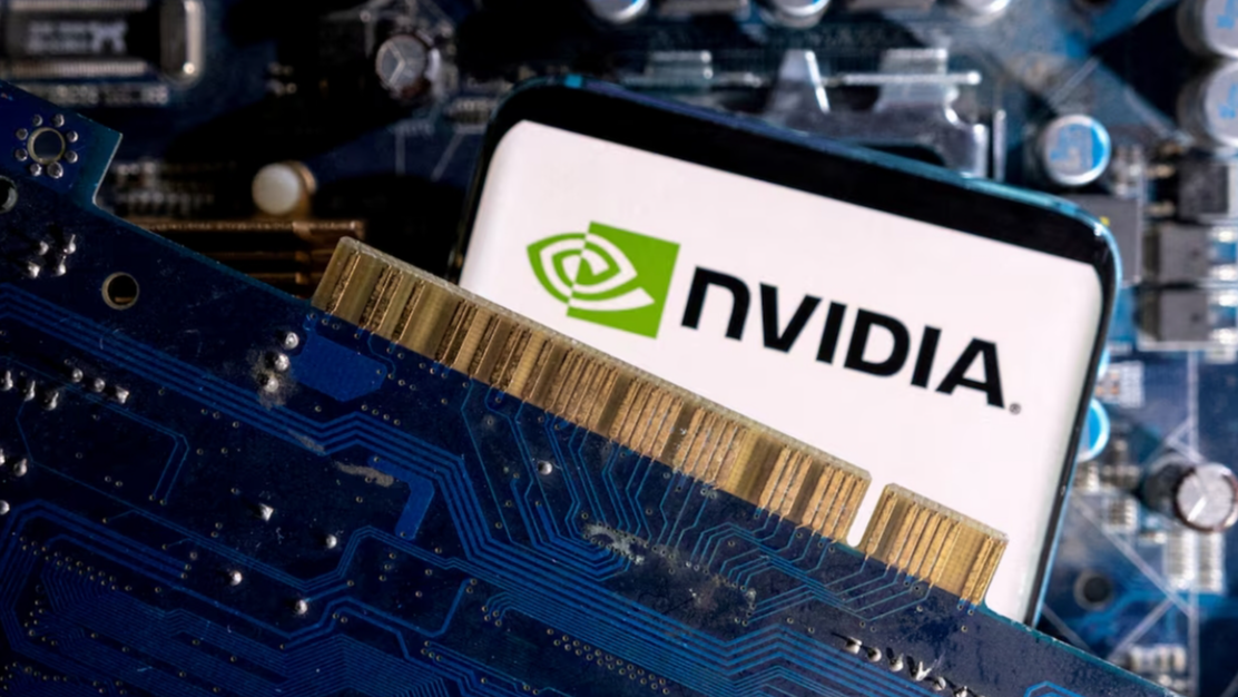 A smartphone with a displayed NVIDIA logo is placed on a computer motherboard, March 6, 2023. /Reuters