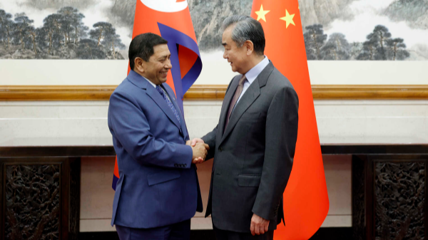 Chinese Foreign Minister Wang Yi (R) shakes hands with Nepal's Deputy Prime Minister and Foreign Minister Narayan Kaji Shrestha in Beijing, China, March 26, 2024. /Chinese Foreign Ministry