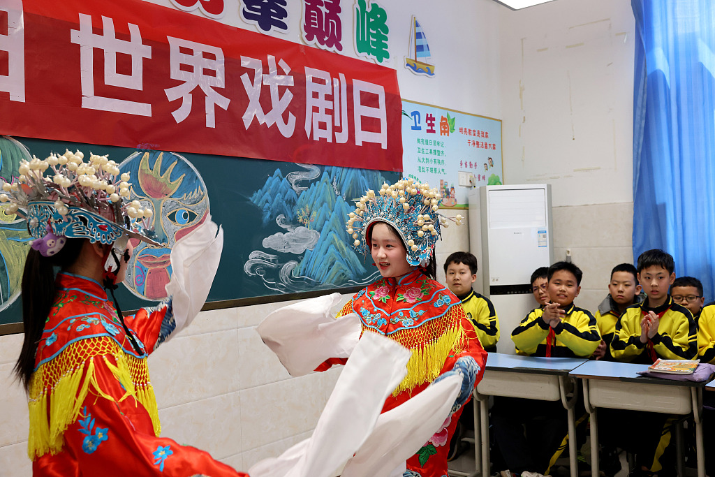 Two students perform an excerpt of Peking Opera Guifei Zuijiu or 