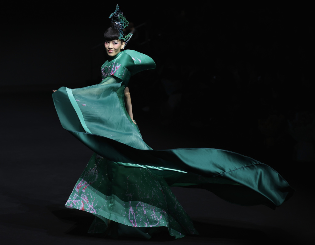 A model wears clothing designed by Chinese designers Bo Yulong and Song Xiaochuan during day two of AW24 China Fashion Week on March 24, 2024 in Beijing. /CFP