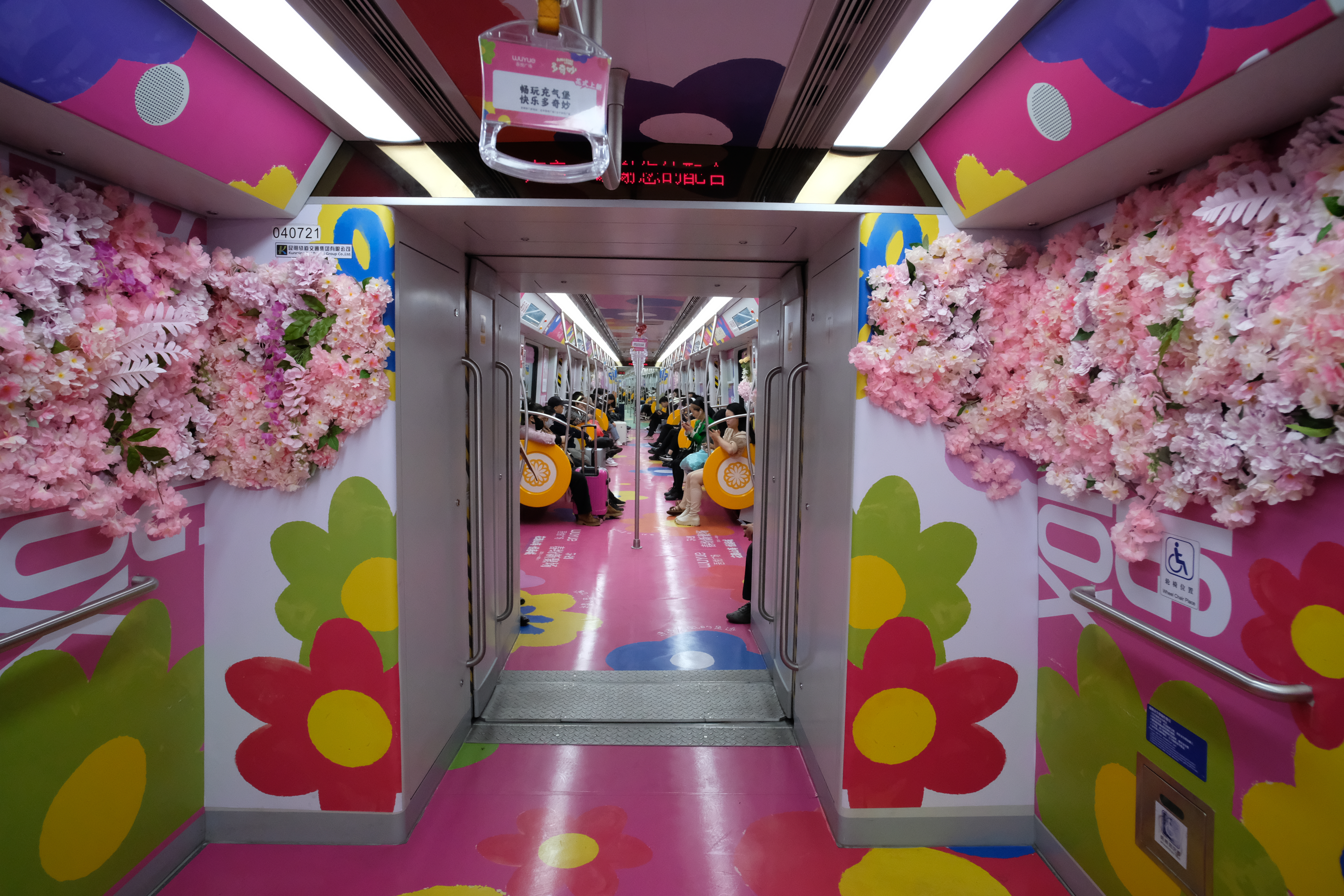 Kunming Metro Line 4, featuring lifelike replicas of blossoms, is pictured on March 27, 2024. /IC