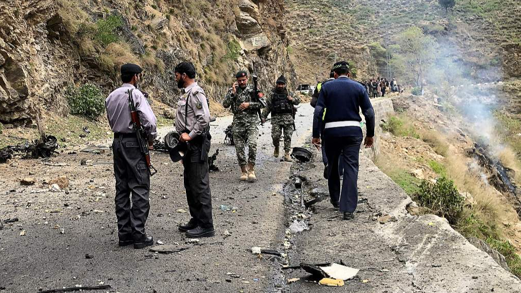 Security personnel inspect the site of a suicide attack near Besham city in the Shangla district of Khyber Pakhtunkhwa Province, Pakistan, March 26, 2024. /CFP