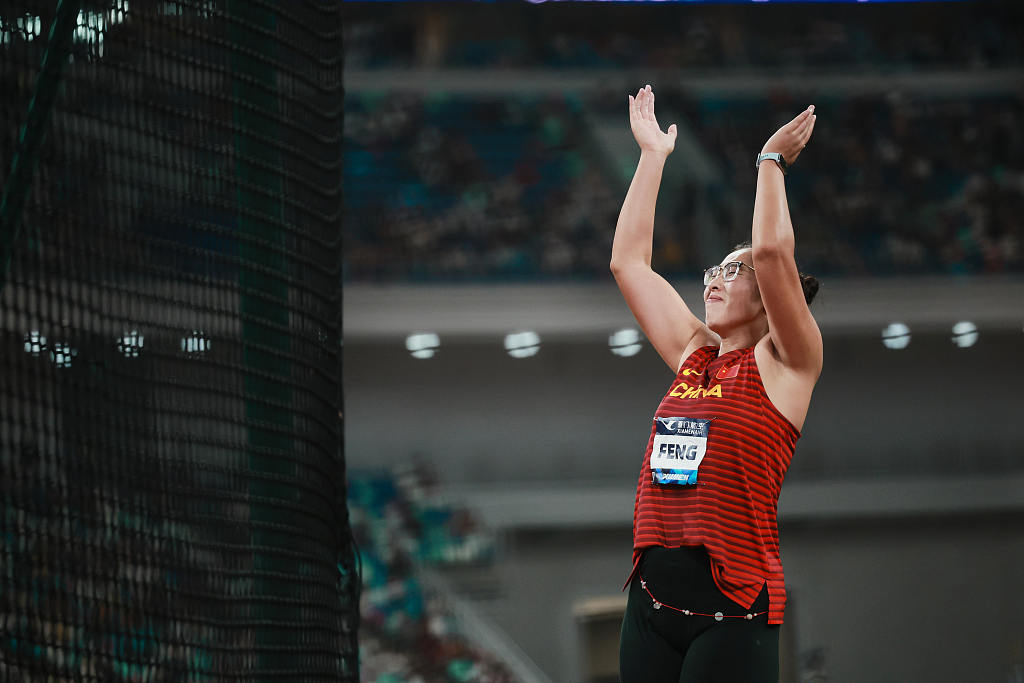 Feng Bin of China celebrates after winning the women's discus throw gold during the World Athletics Diamond League meeting in Xiamen, China, September 2, 2023. /CFP 
