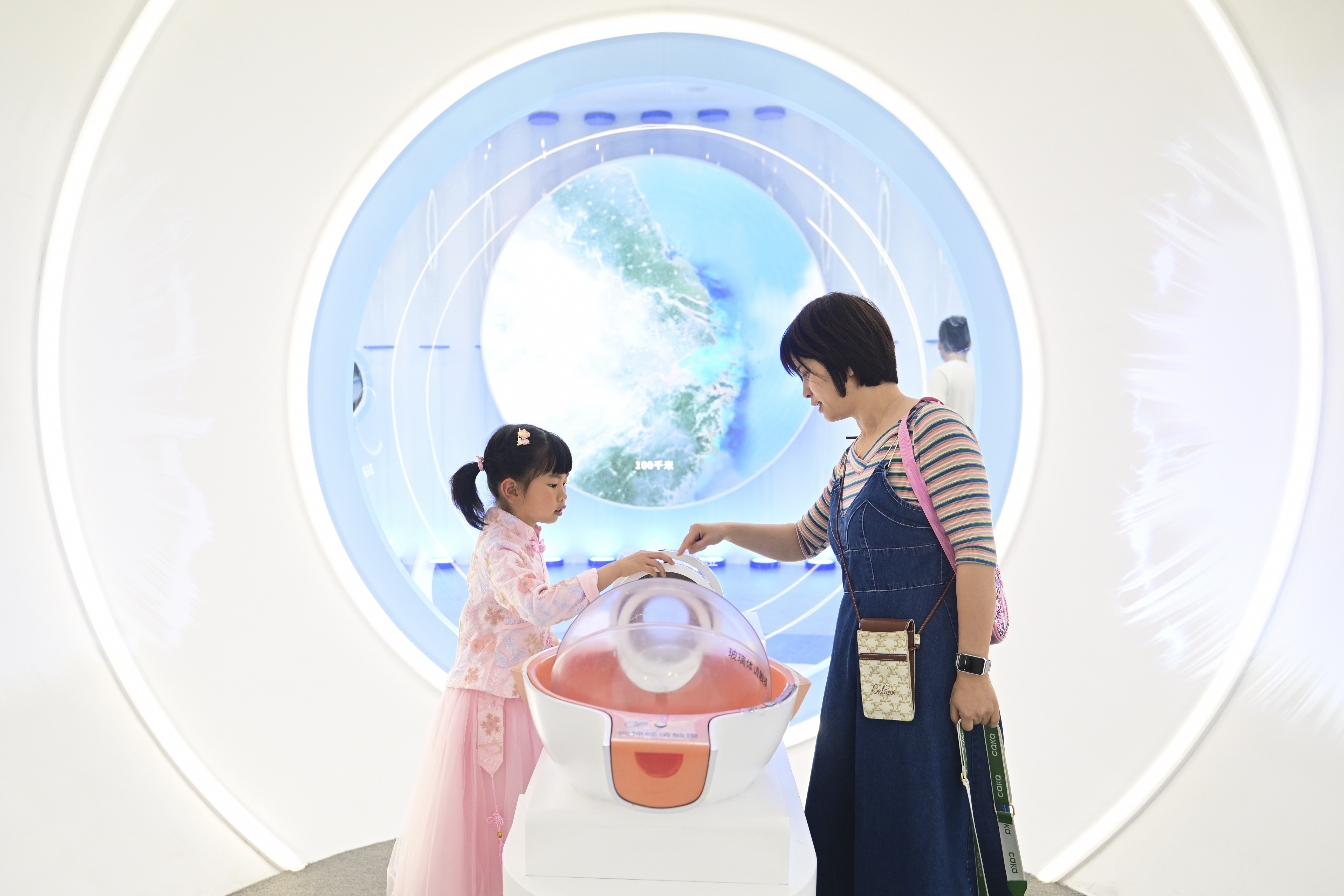 Visitors are pictured at the metaverse space at the EDCC in Suzhou, Jiangsu Province on May 3, 2023. /IC