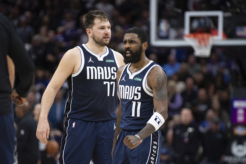 Kyrie Irving (#11) and Luka Doncic (#77) of the Dallas Mavericks look on in the game against the Sacramento Kings at Golden 1 Center in Sacramento, California, March 29, 2024. /CFP