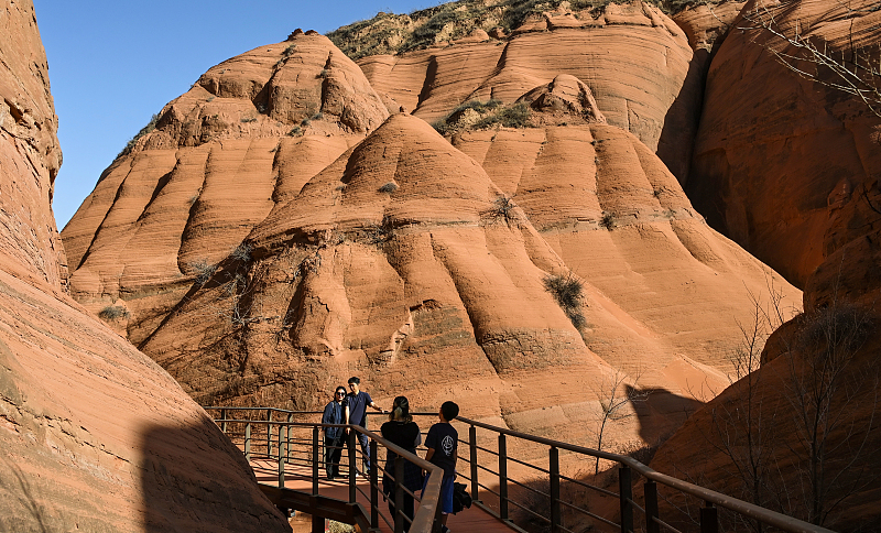 As a gift from nature, the Longzhou Danxia landform attracts many visitors to admire its spectacular view in Yulin City, Shaanxi Province, March 30, 2024. /CFP