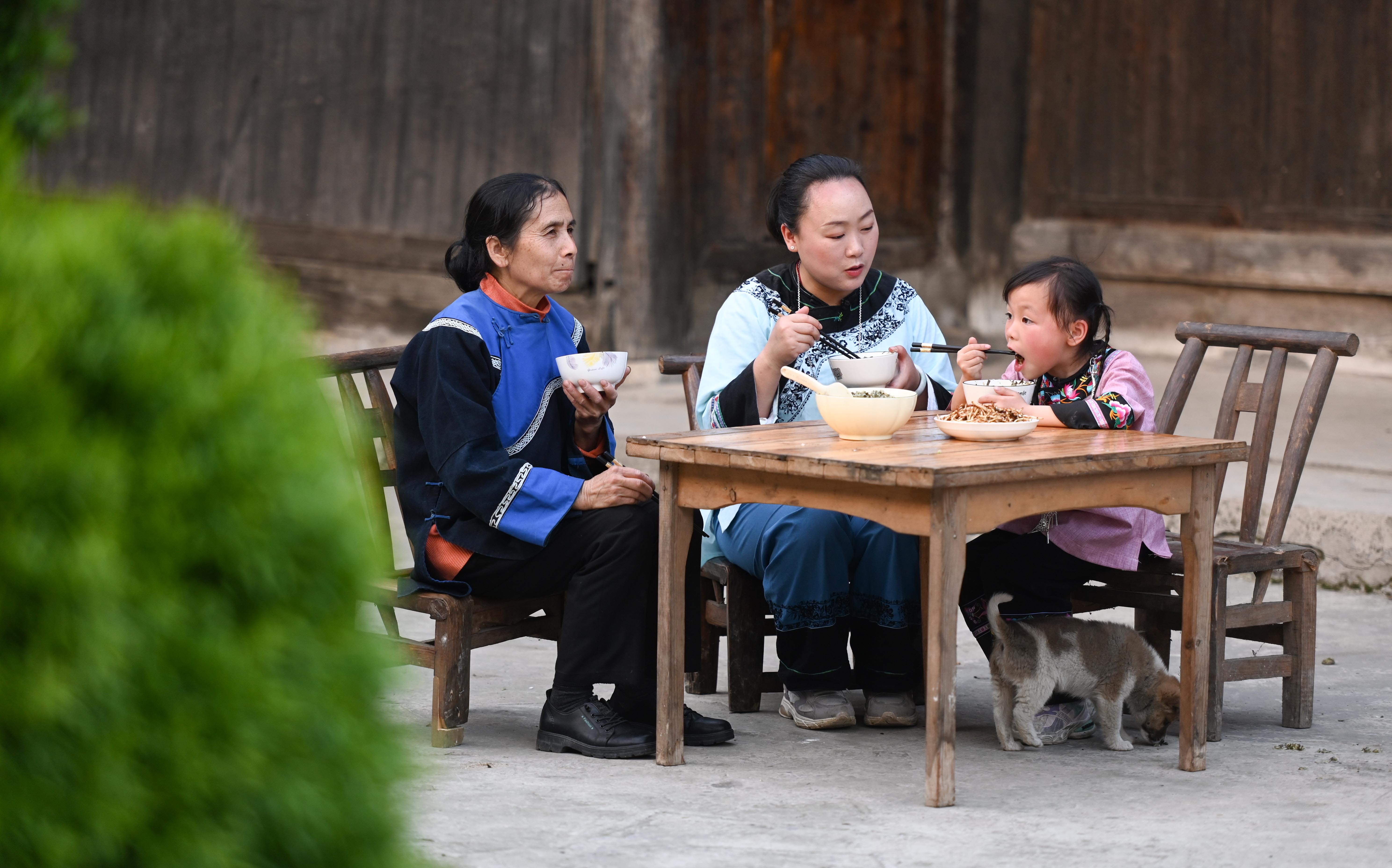 Locals eat Shefan in Songtao Miao Autonomous County, Guizhou Province on March 24, 2024. /Photo provide to CGTN 