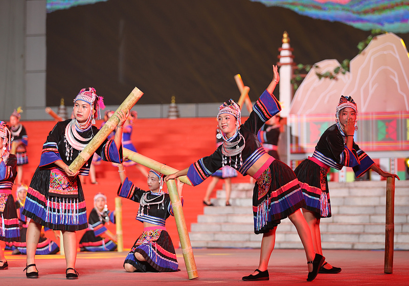 Women of the Lahu ethnic group perform their traditional dance to celebrate the Calabash Festival at Lancang County, Yunnan Province, March 31, 2024. /CFP
