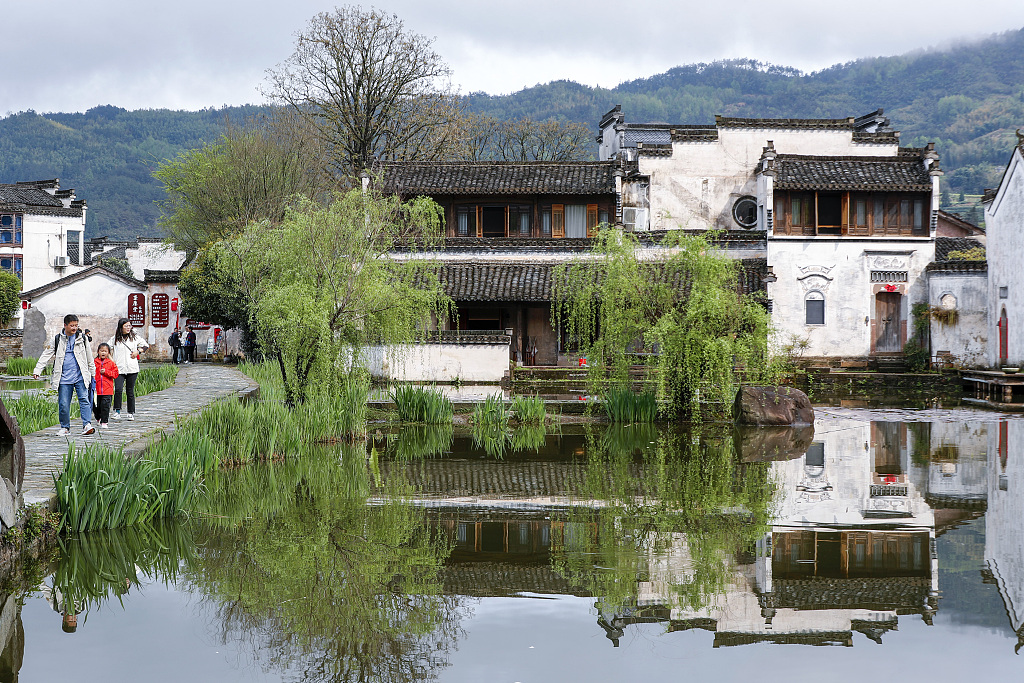 People visit the Chengkan ancient village in Huangshan, Anhui Province on April 2, 2024. /CFP