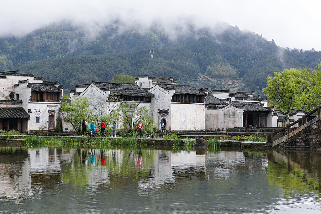People visit the Chengkan ancient village in Huangshan, Anhui Province on April 2, 2024. /CFP