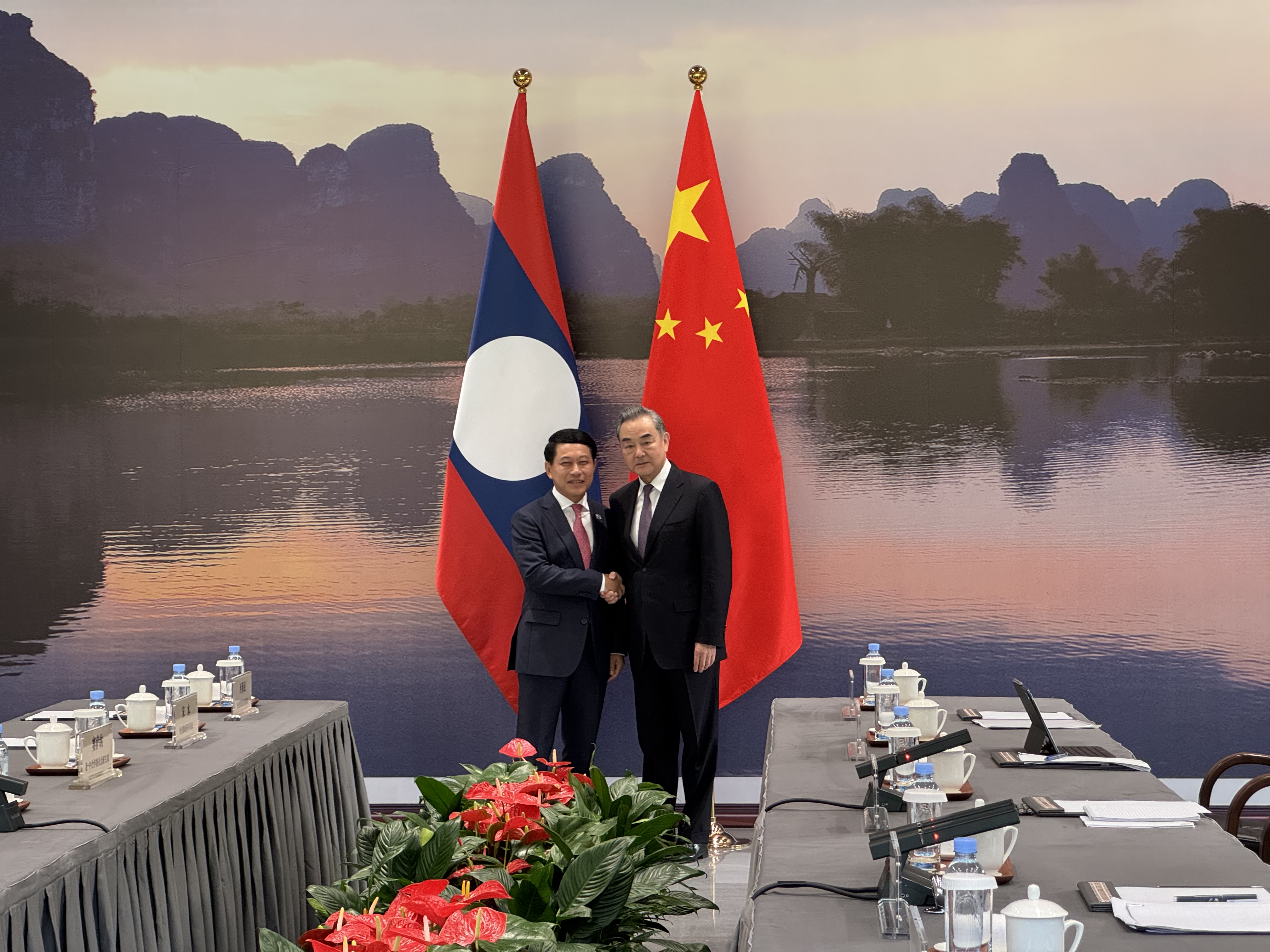 Chinese Foreign Minister Wang Yi (R), also a member of the Political Bureau of the Communist Party of China Central Committee, meets Lao Deputy Prime Minister and Minister of Foreign Affairs Saleumxay Kommasith in Guangxi Zhuang Autonomous Region, south China, April 3, 2024. /CGTN