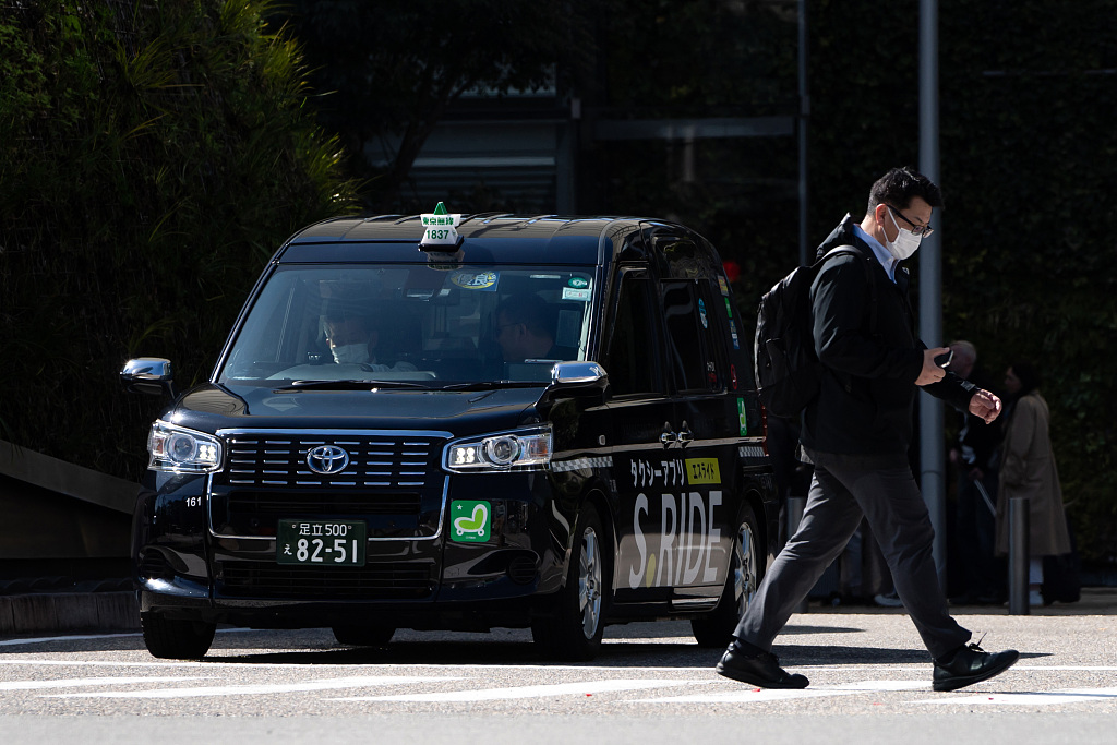 A taxi on the road in Tokyo, Japan. The government partially lifted a ban on ride-sharing services in April due to a shortage of taxi drivers, Tokyo, Japan, March 27, 2024 