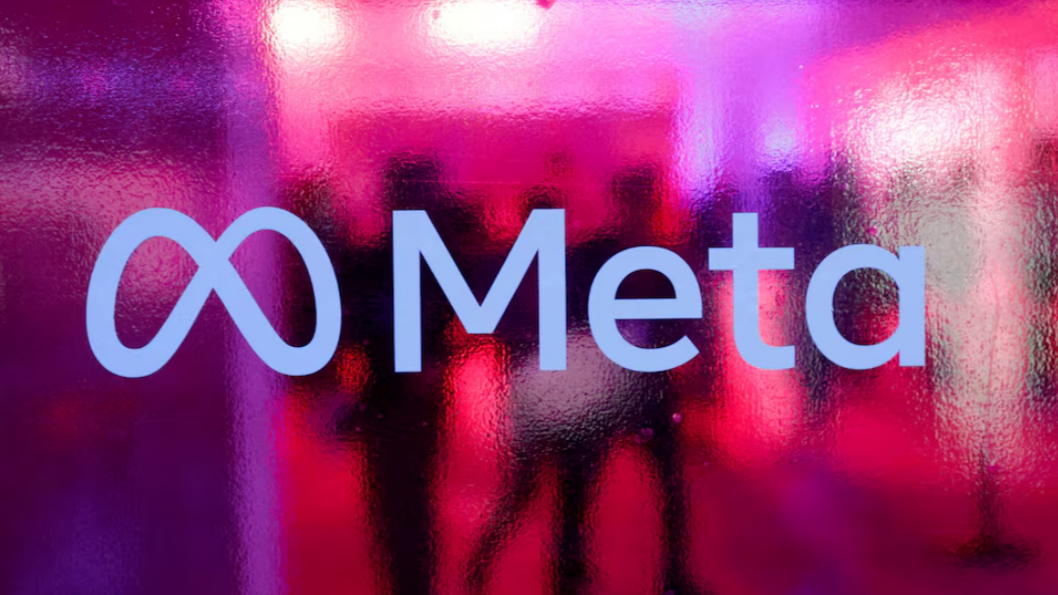 People walk behind a Meta Platforms logo during a conference in Mumbai, India, September 20, 2023. /Reuters