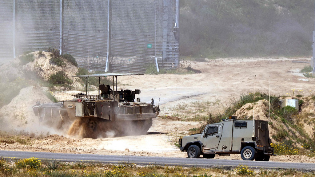 Israeli army vehicles move in an area along the border with the Gaza Strip and southern Israel, April 4, 2024. /CFP