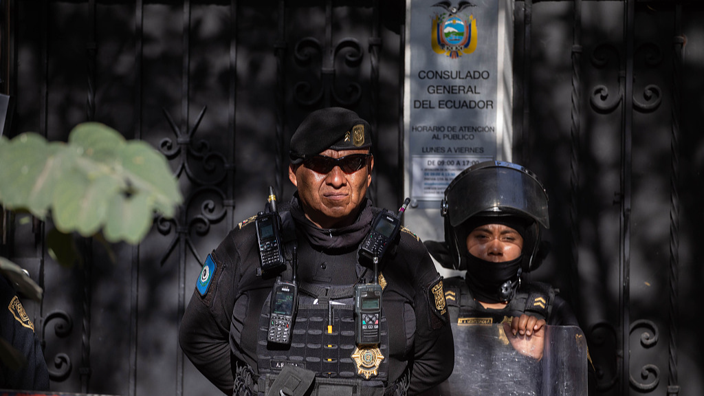 Police officers stand guard outside the embassy of Ecuador in Mexico during a protest in Mexico City, Mexico, April 6, 2024. /CFP