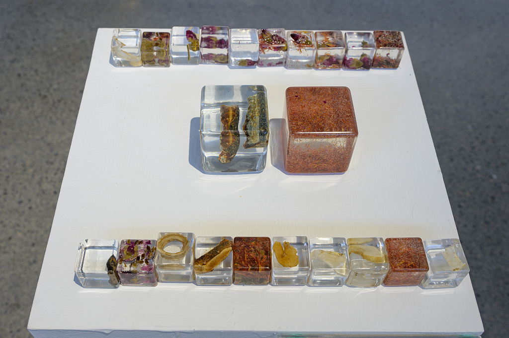 Artworks created by young artists using the residues of traditional Chinese medicine and other related waste are on display at the Sanhe Art Museum in Chongqing Municipality on April 8, 2024. /CFP