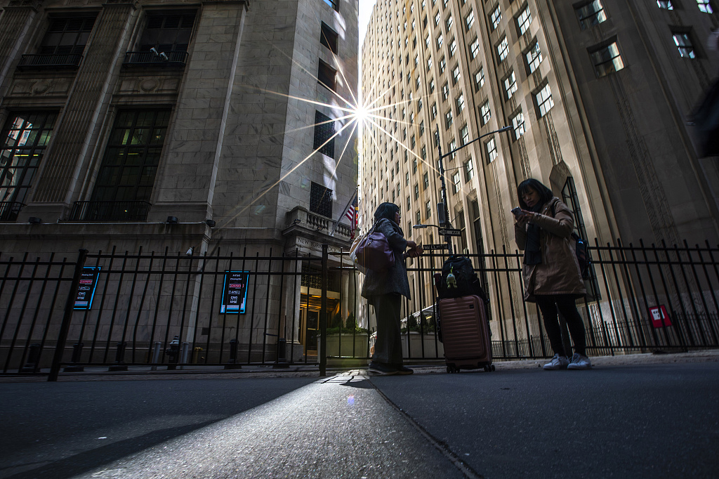 Pedestrians walk near the New York Stock Exchange in New York, U.S. March 19, 2024. /CFP