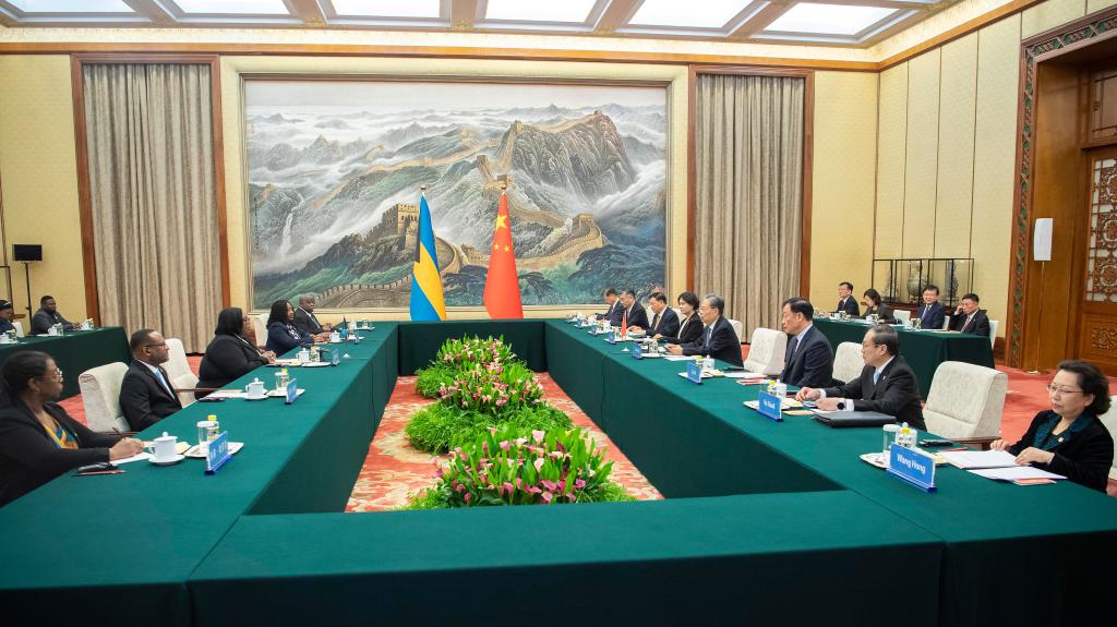 Zhao Leji, chairman of the National People's Congress (NPC) Standing Committee, holds talks with Speaker of the House of Assembly Patricia Deveaux and President of the Senate Julie LaShell Adderley of the Bahamian parliament at the Great Hall of the People in Beijing, China, April 9, 2024. /Xinhua